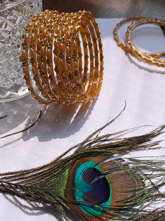 Set of 12 Golden Glass Bangles with Floral Detailing (Set of 12 )