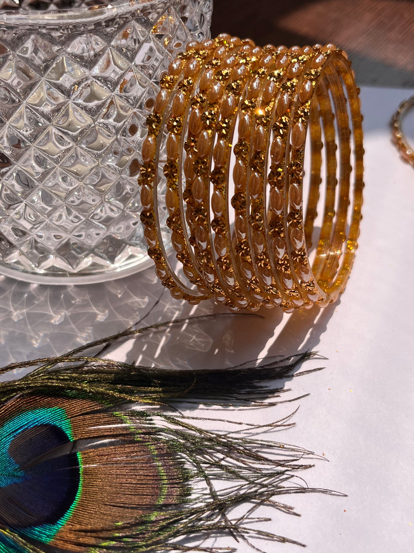 Set of 12 Golden Glass Bangles with Floral Detailing (Set of 12 )